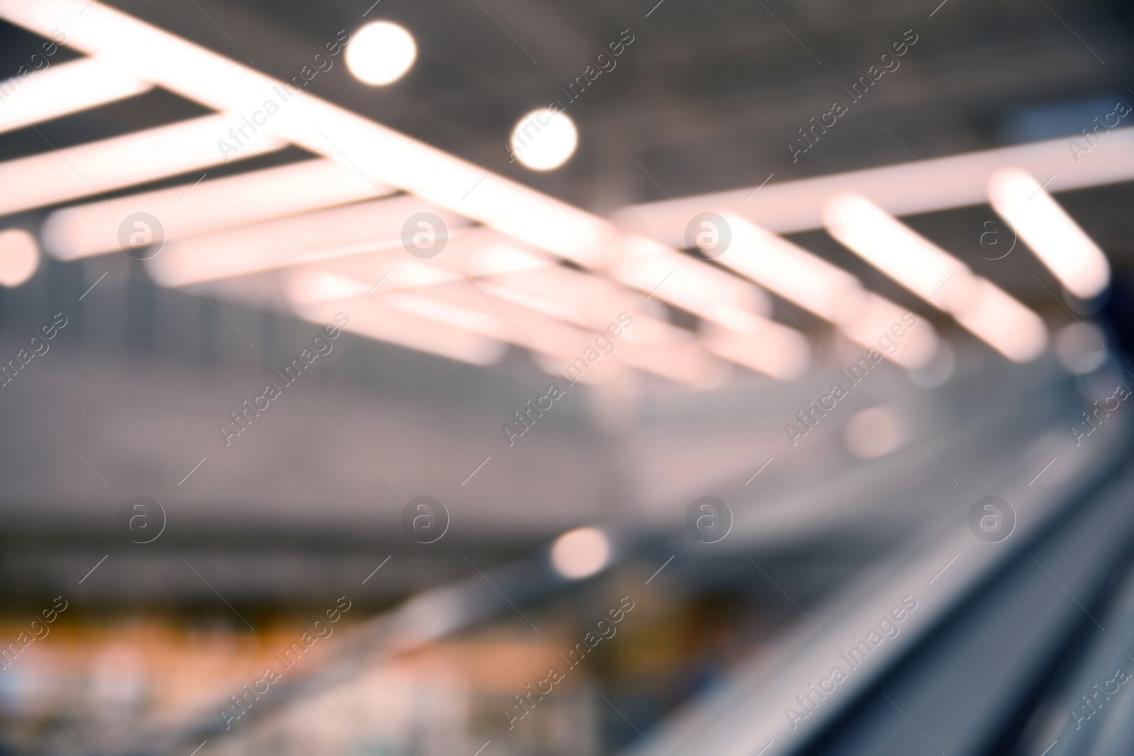 Photo of Blurred view of modern shopping mall interior