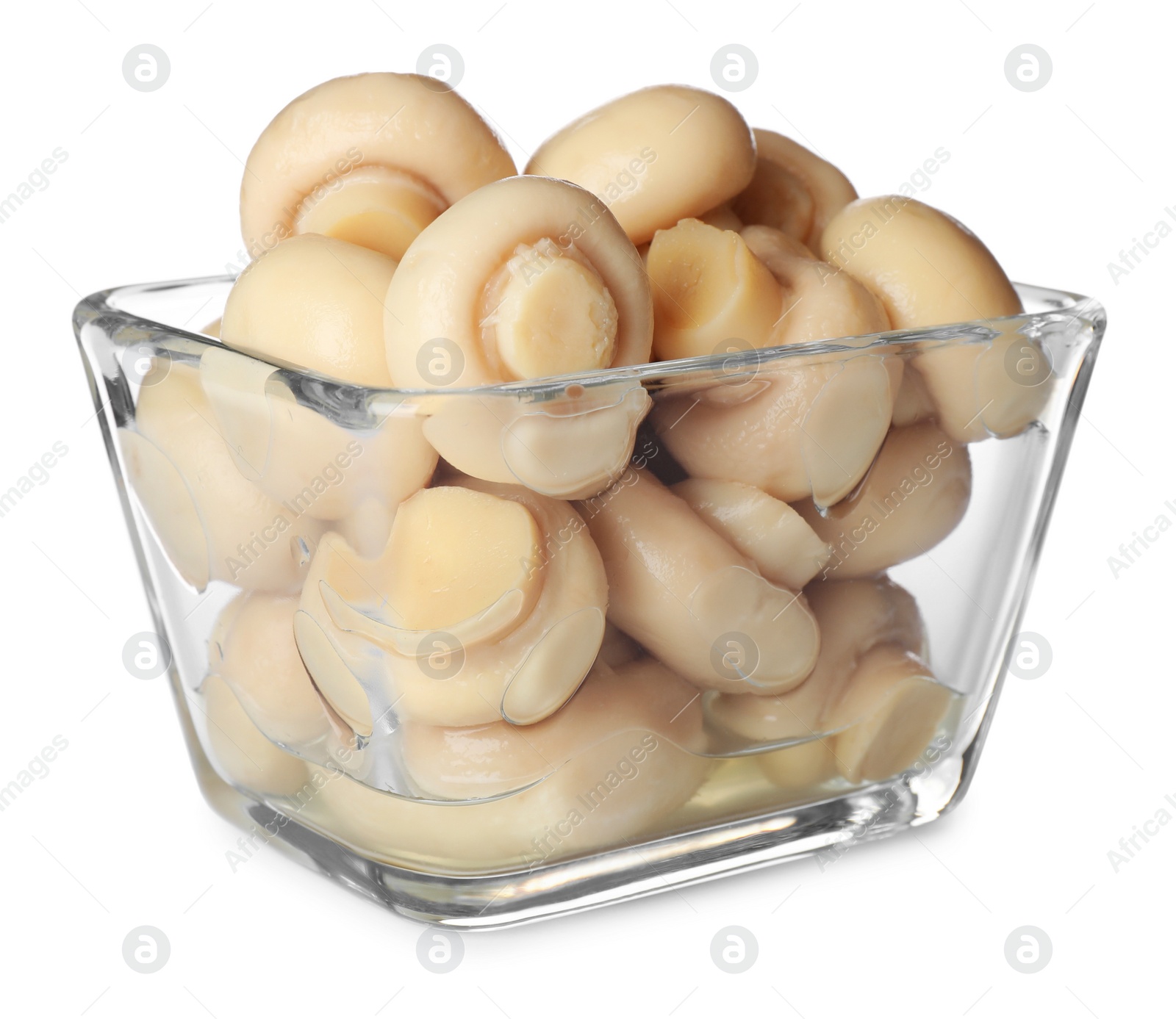 Photo of Tasty marinated mushrooms in glass bowl isolated on white