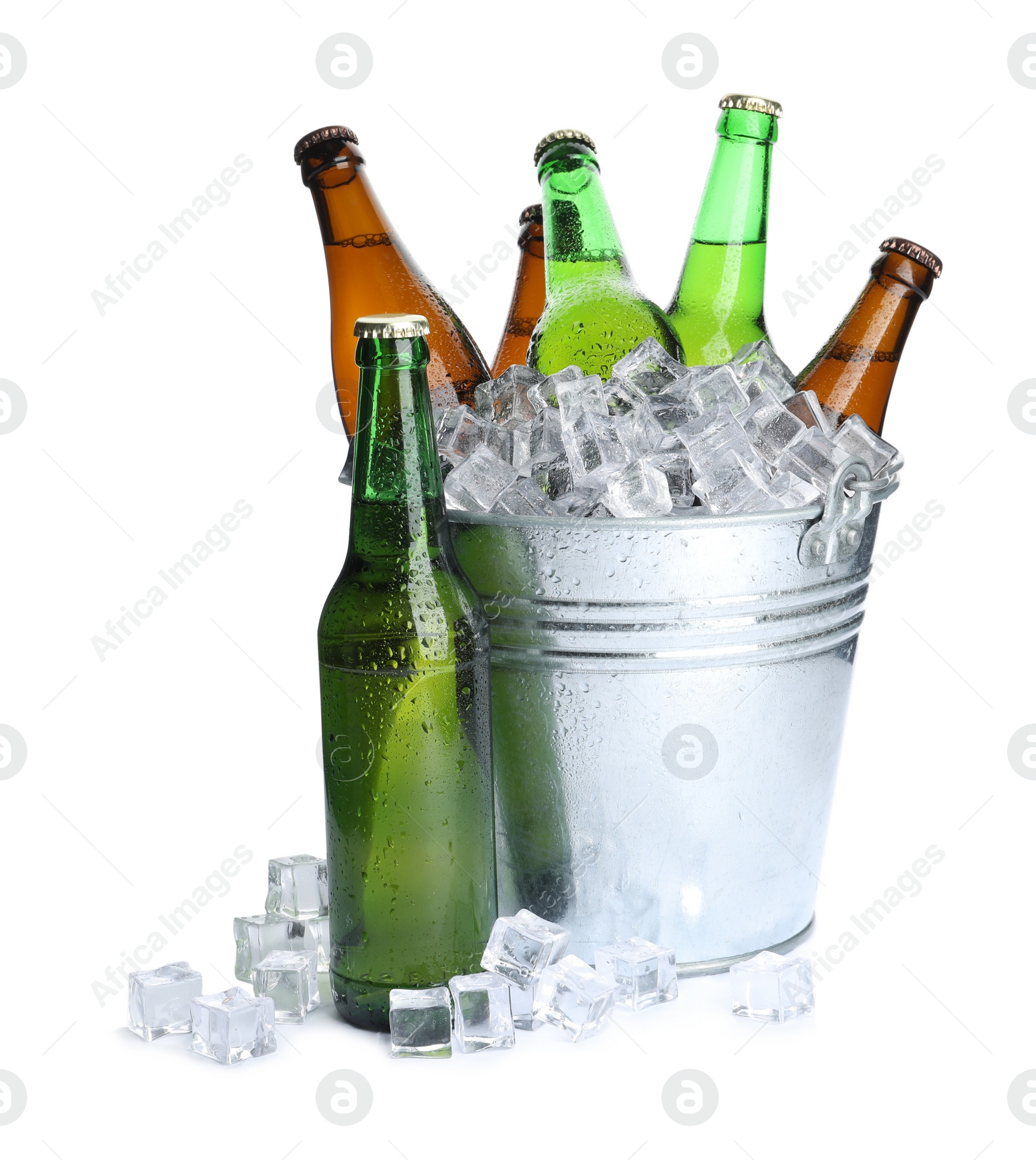 Photo of Metal bucket with bottles of beer and ice cubes isolated on white