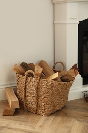 Photo of Basket with firewood on floor in room