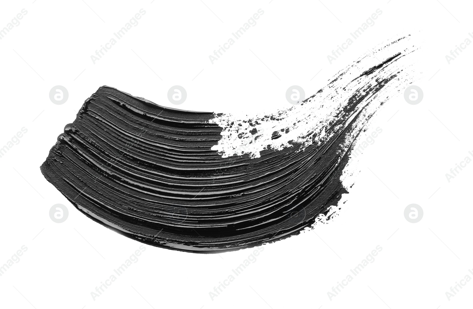 Photo of Brushstroke of black oil paint on white background, top view