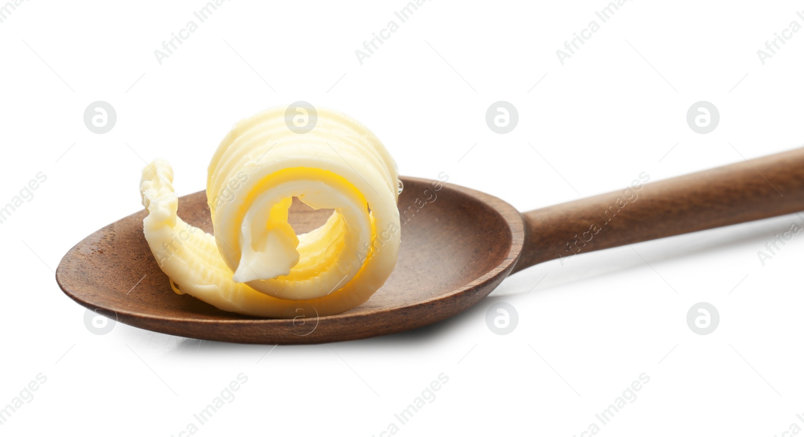 Photo of Wooden spoon with butter curl on white background