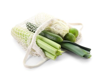 String bag with different vegetables isolated on white