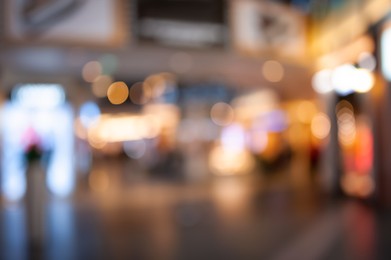 Photo of Blurred view of modern shopping mall interior