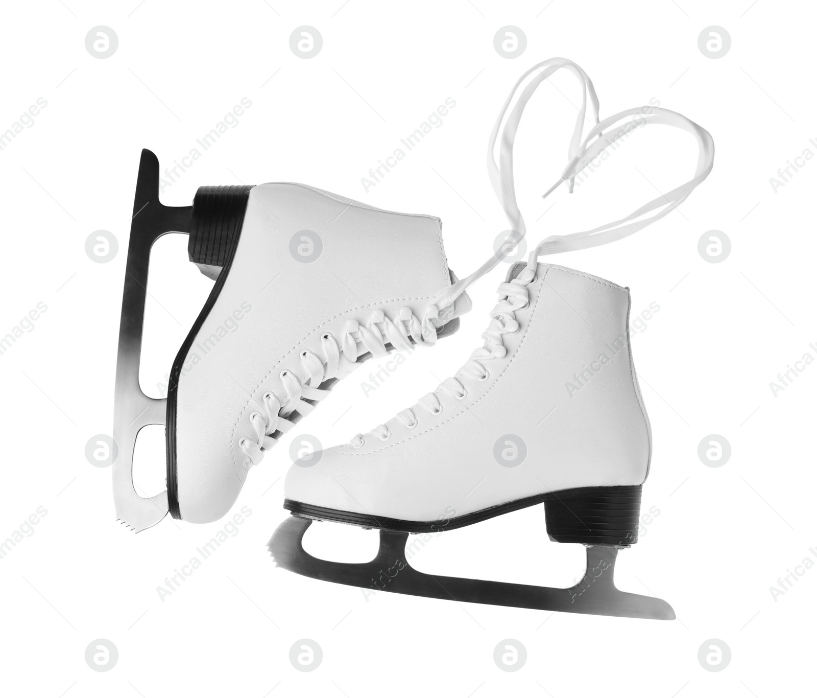 Photo of Pair of figure ice skates isolated on white, top view