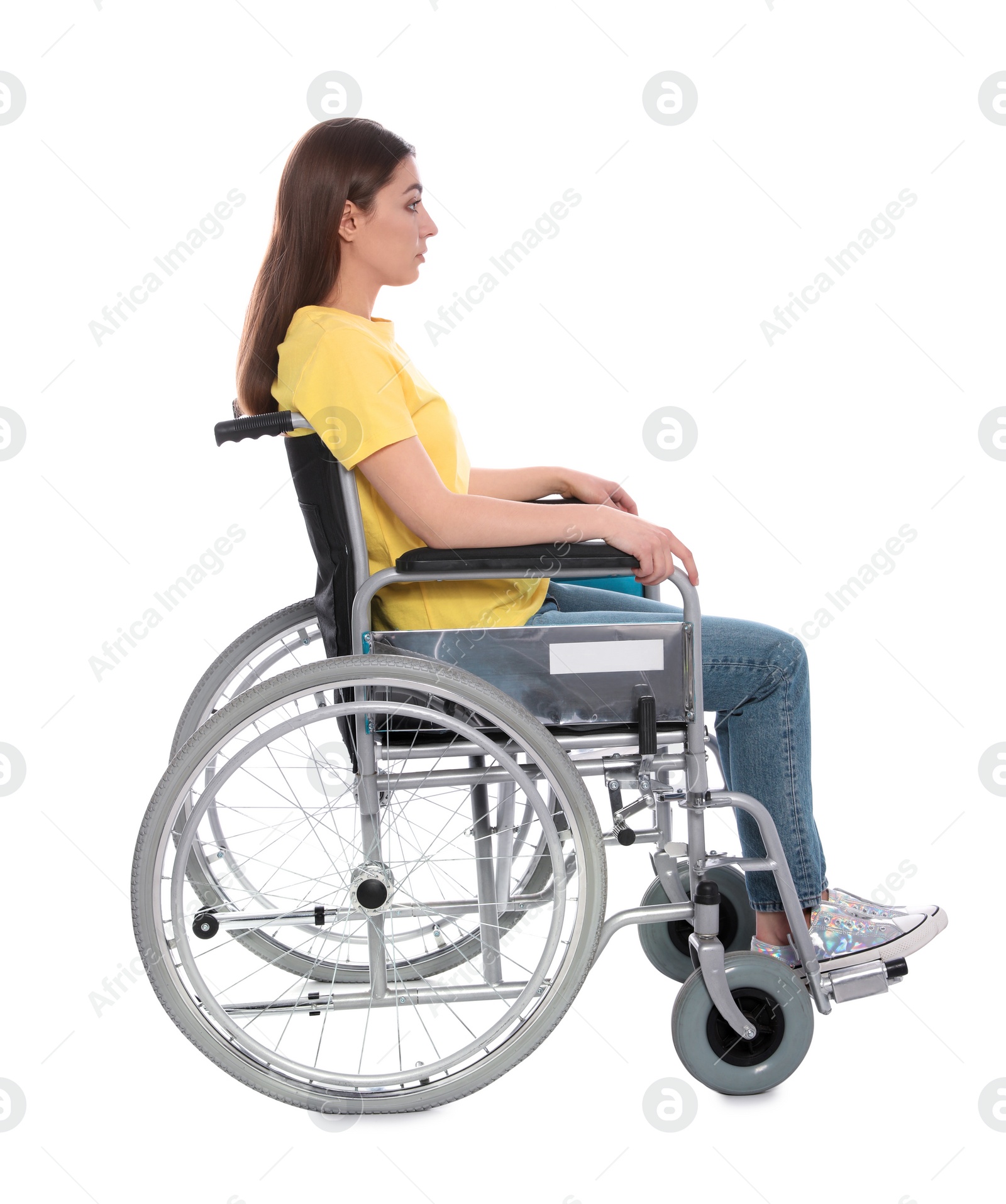 Photo of Young woman in wheelchair isolated on white