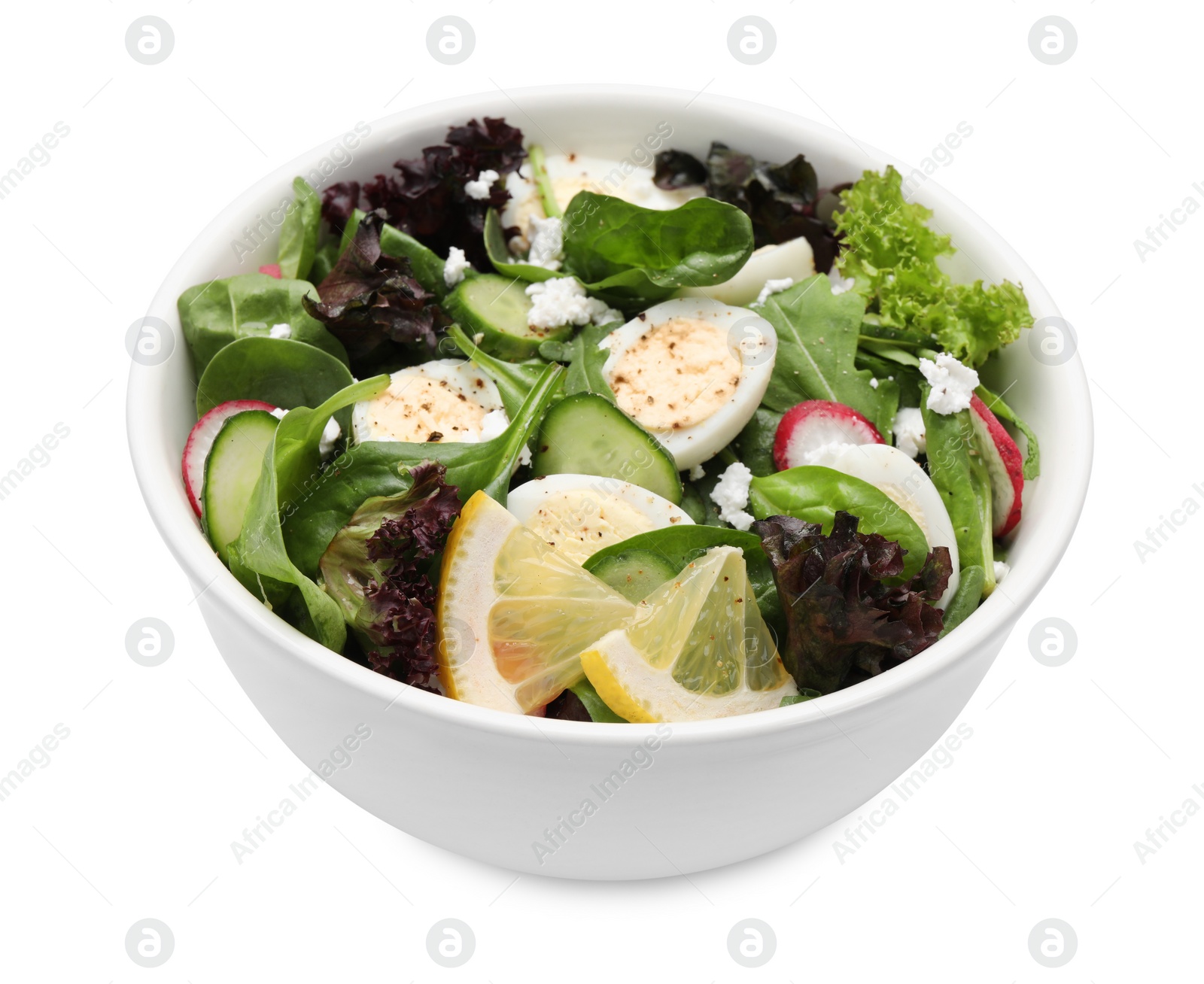 Photo of Delicious salad with boiled eggs, vegetables and lemon in bowl isolated on white