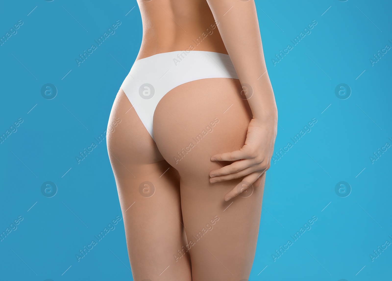 Photo of Slim young woman with smooth gentle skin on color background, closeup. Beauty and body care concept