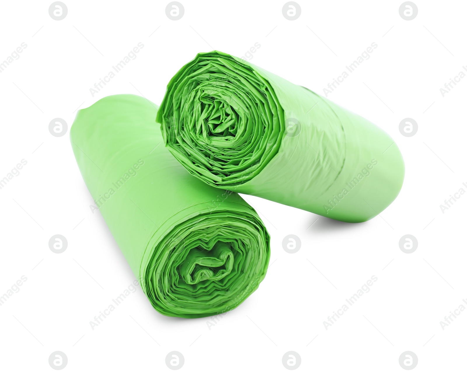 Photo of Two rolls of light green garbage bags isolated on white