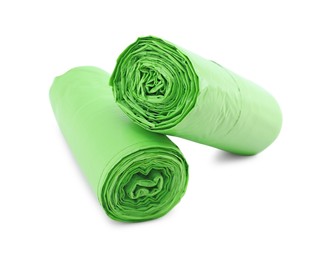 Photo of Two rolls of light green garbage bags isolated on white