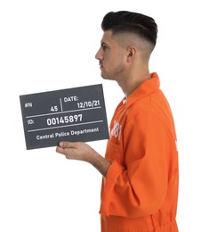 Mug shot of prisoner in orange jumpsuit with board on white background, side view