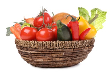 Photo of Fresh ripe vegetables and fruit in wicker bowl on white background