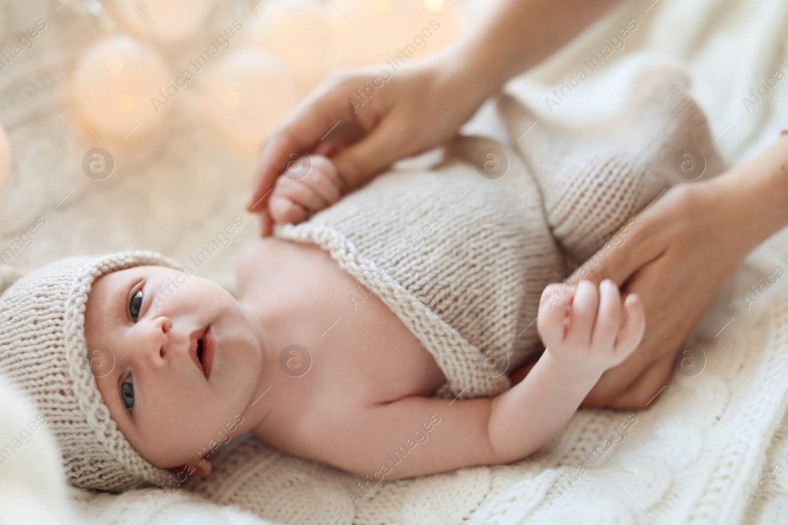 Photo of Young mother with her newborn baby at home