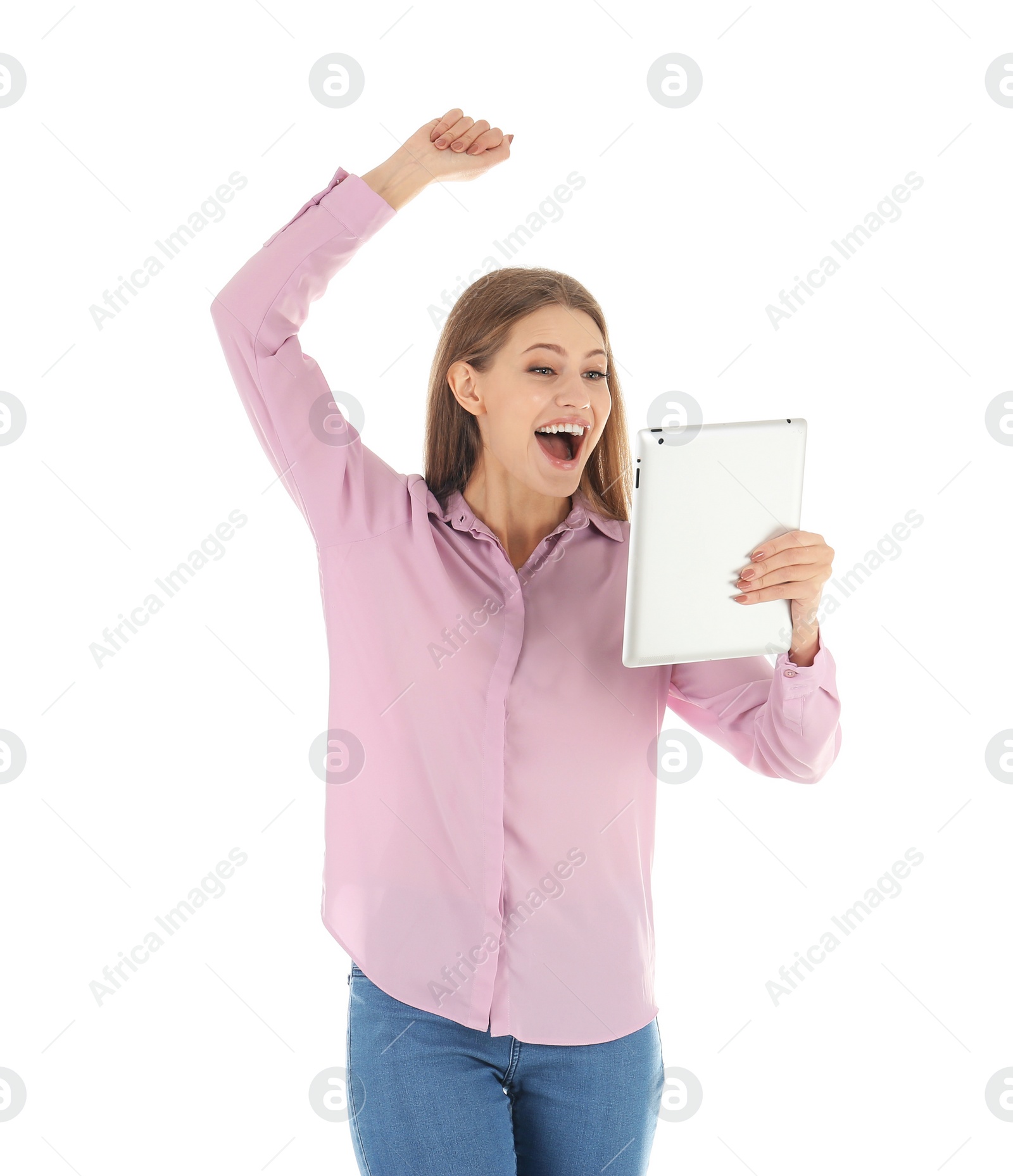 Photo of Emotional young woman with tablet celebrating victory on white background