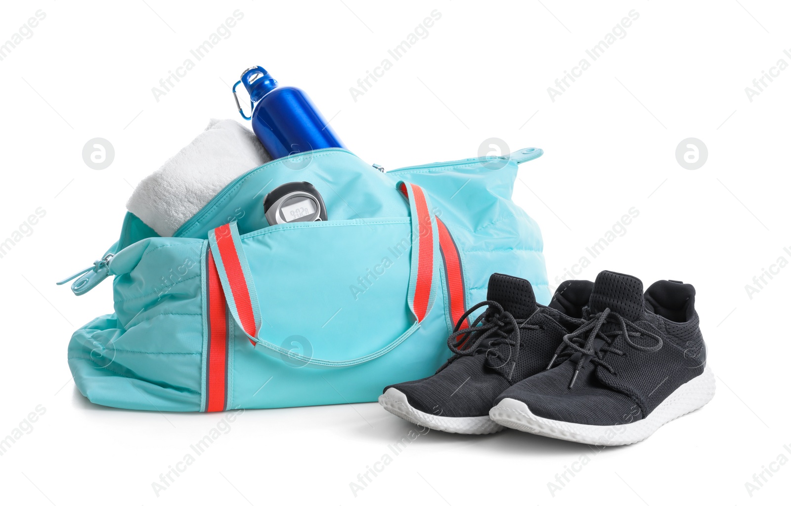 Photo of Sports bag with gym equipment on white background