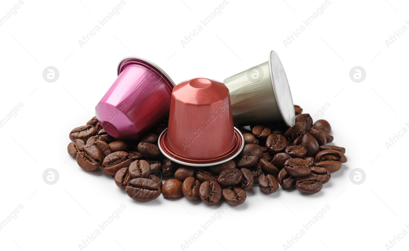 Photo of Many coffee capsules and beans isolated on white