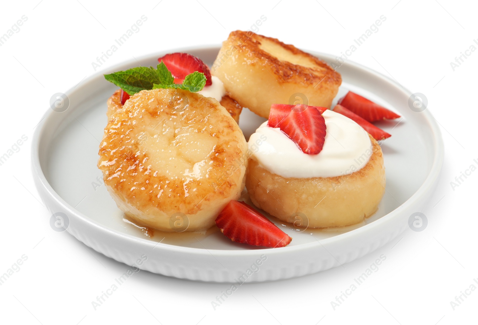 Photo of Delicious cottage cheese pancakes with strawberries, honey and sour cream on white background