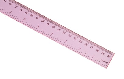 Photo of Plastic pink ruler isolated on white, top view