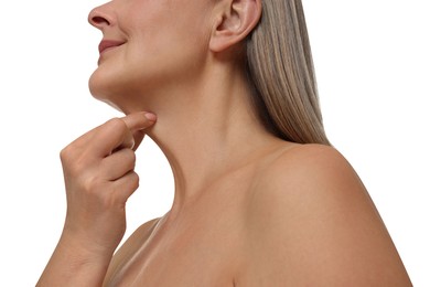 Photo of Mature woman touching her neck on white background, low angle view