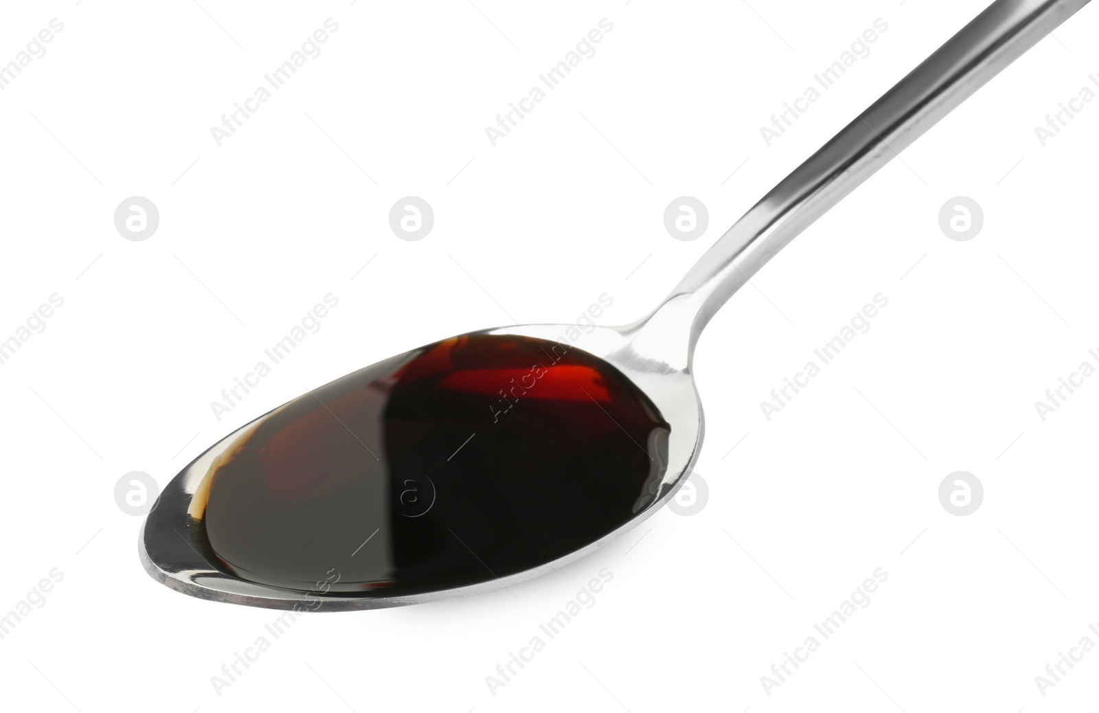 Photo of Tasty soy sauce in spoon isolated on white