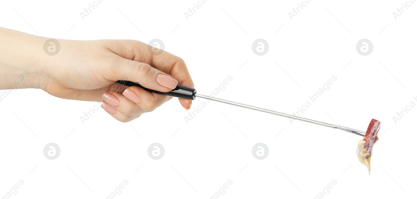 Photo of Tasty fondue. Woman holding fork with salami and melted cheese on white background, closeup