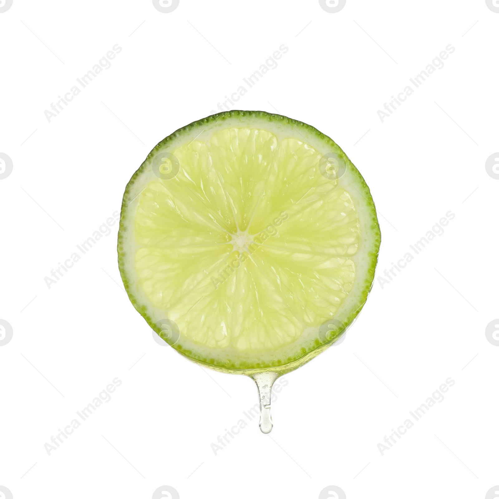 Photo of Slice of lime with dripping essential oil isolated on white