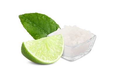 Image of Cut lime and salt isolated on white. Margarita cocktail ingredients