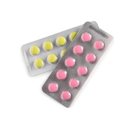 Blisters with different pills on white background, top view