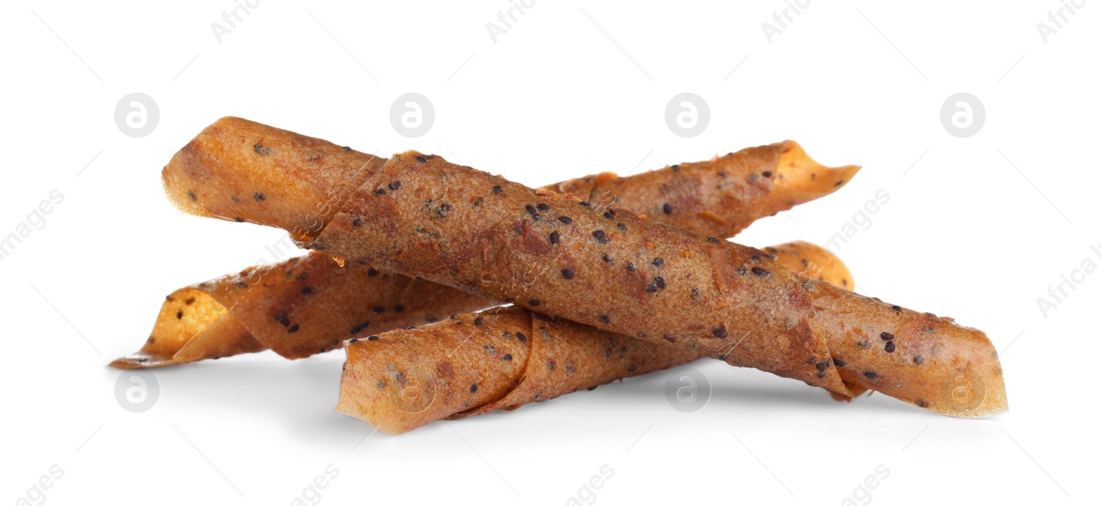 Photo of Delicious fruit leather rolls on white background