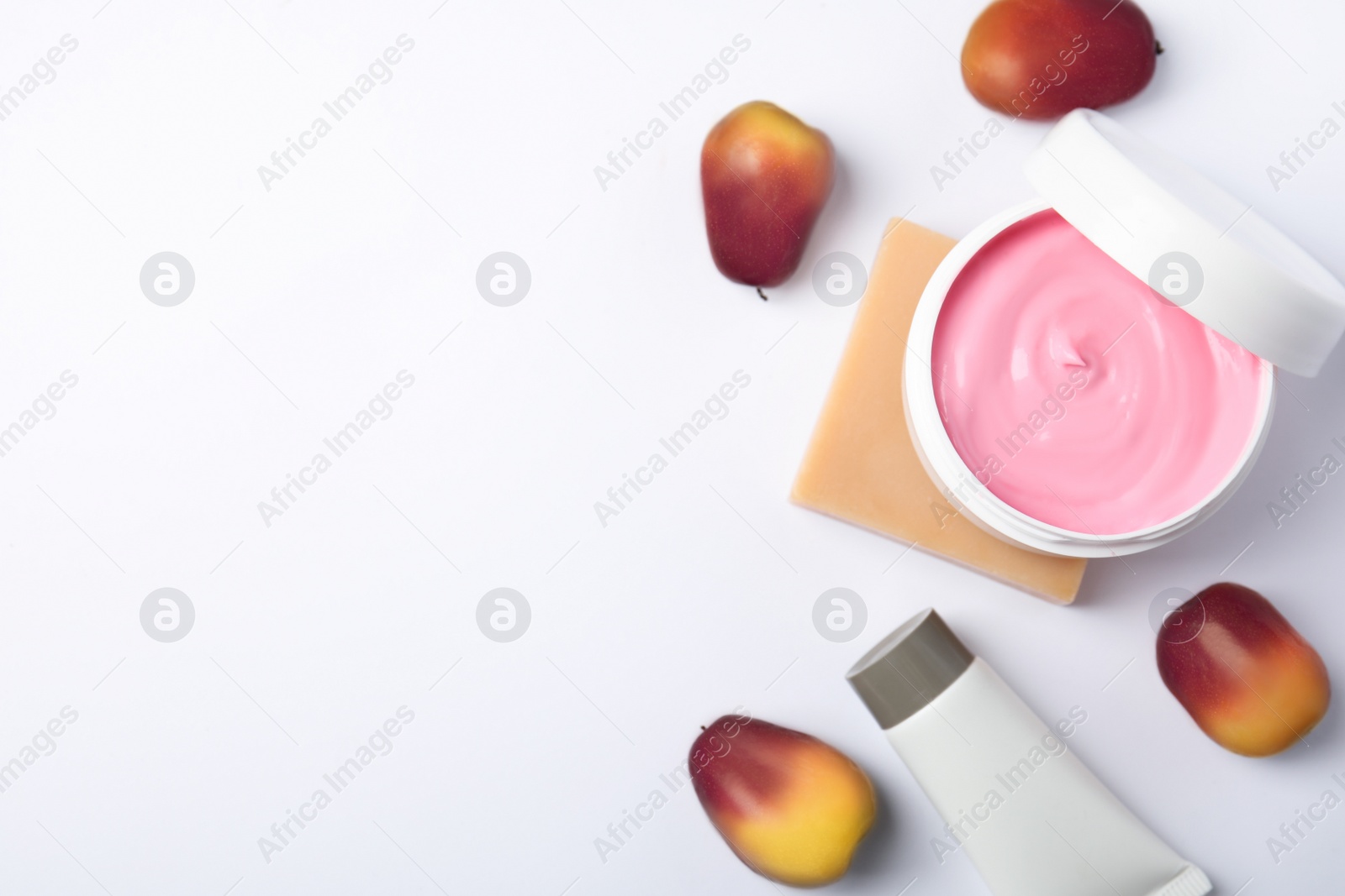 Image of Fresh ripe palm oil fruits and cosmetic products on white background, top view
