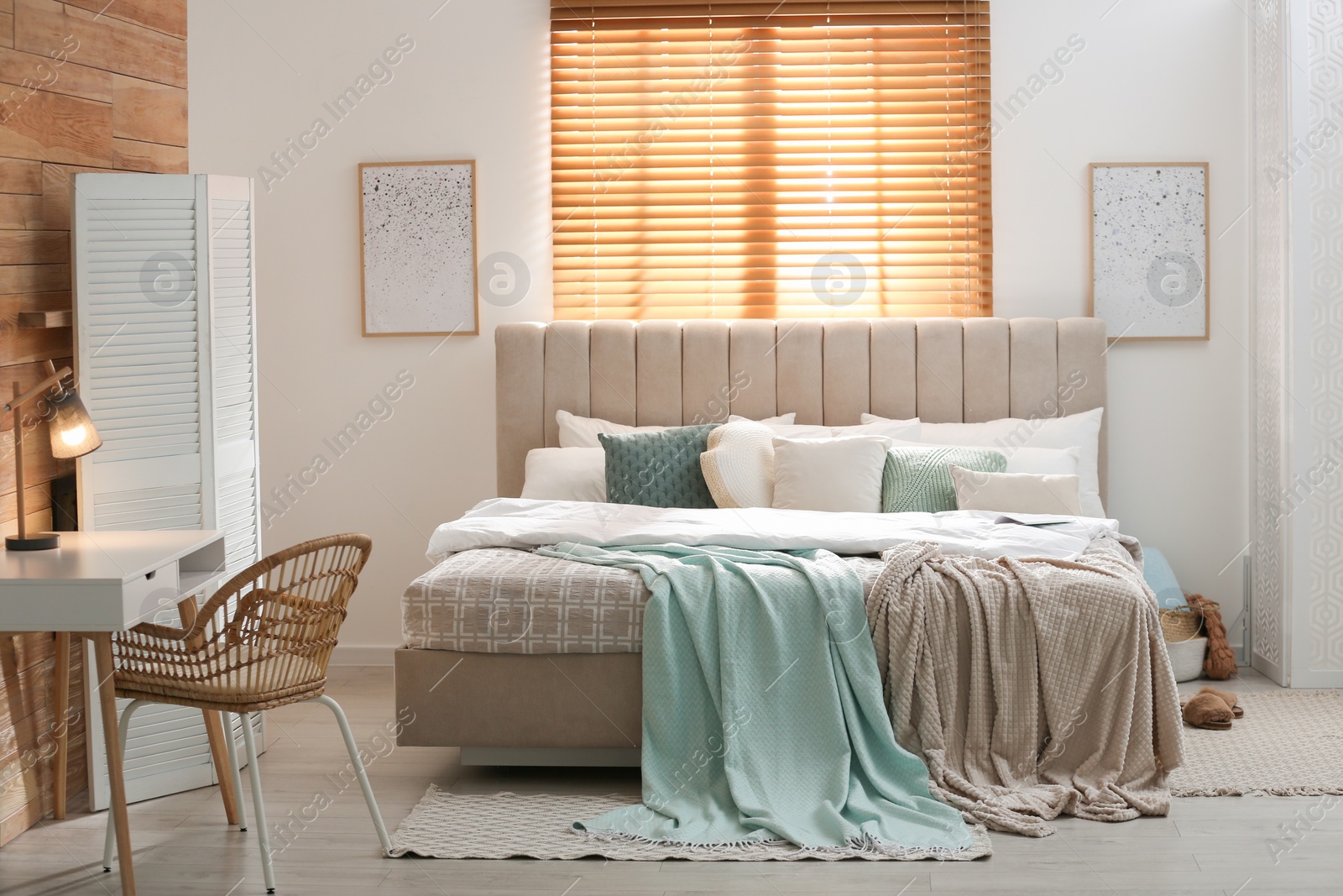 Photo of Stylish room interior with big comfortable bed