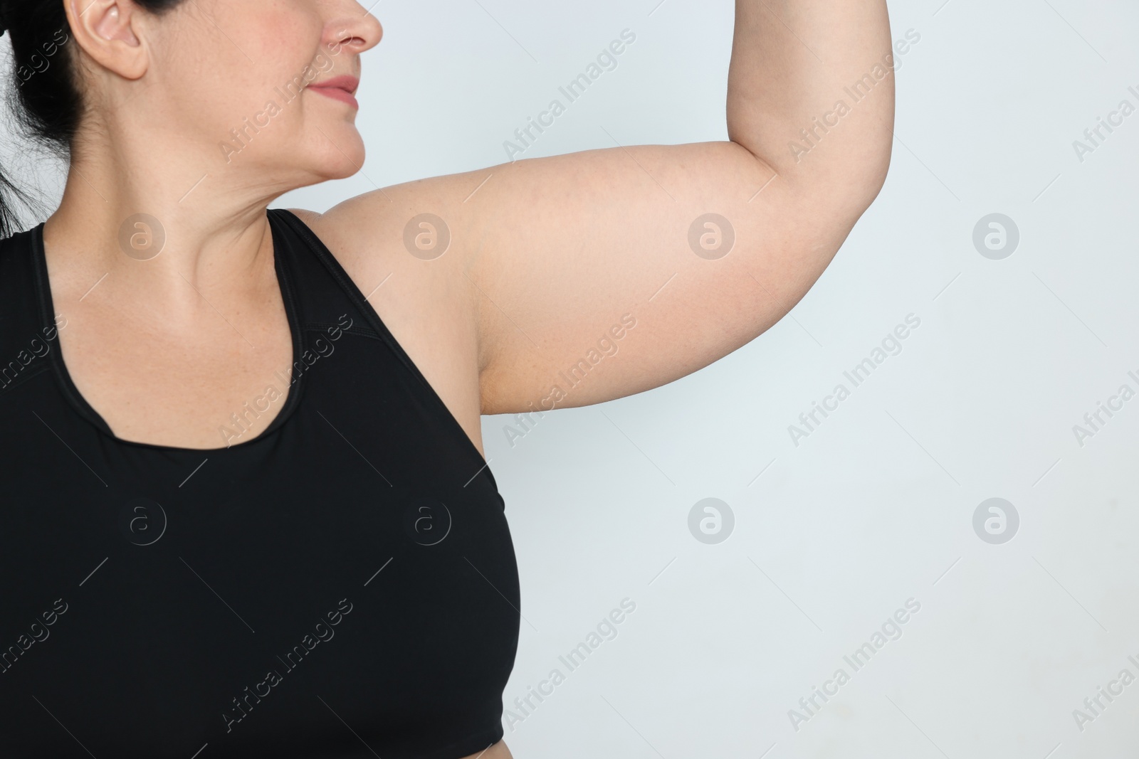 Photo of Obese woman on white background, closeup with space for text. Weight loss surgery