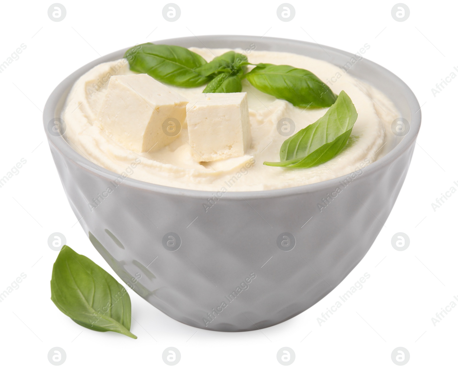 Photo of Delicious tofu sauce and basil leaves isolated on white