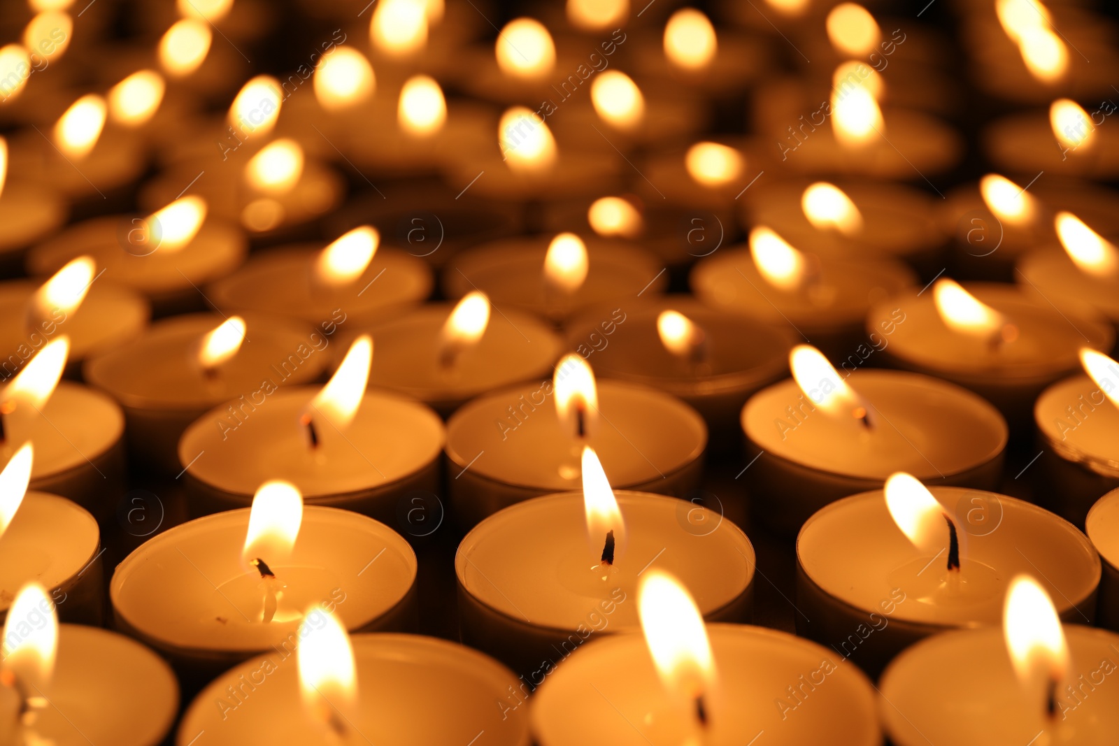 Photo of Many burning candles as background. Memory day