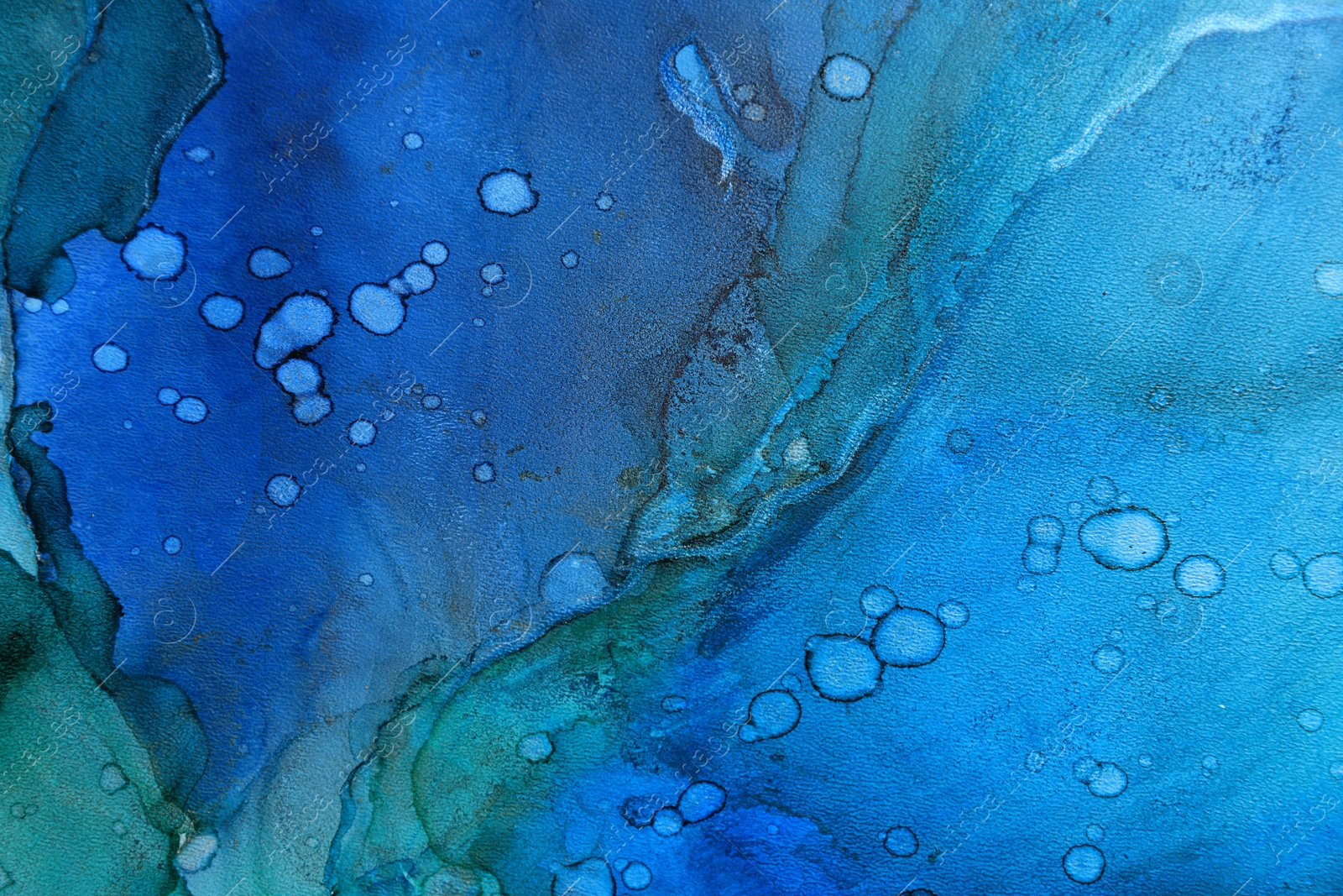 Photo of Abstract liquid ink art painting as background, top view