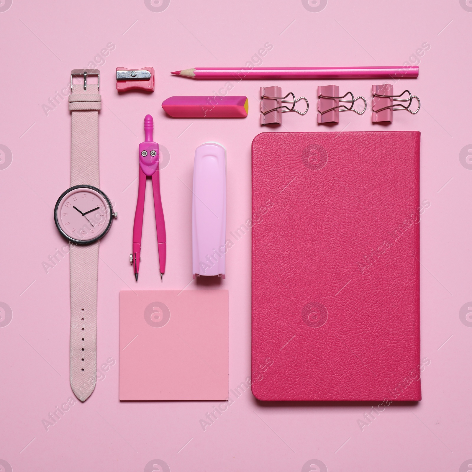 Photo of Different stationery on pink background, flat lay