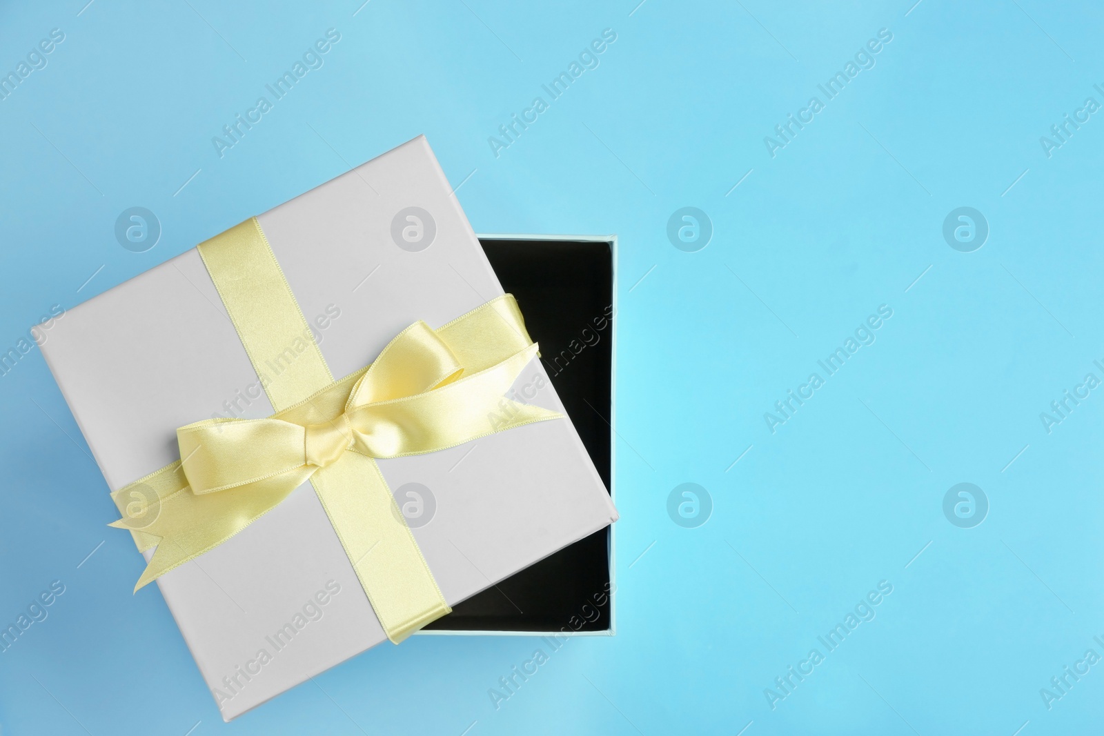 Photo of Beautifully decorated gift box on color background, top view