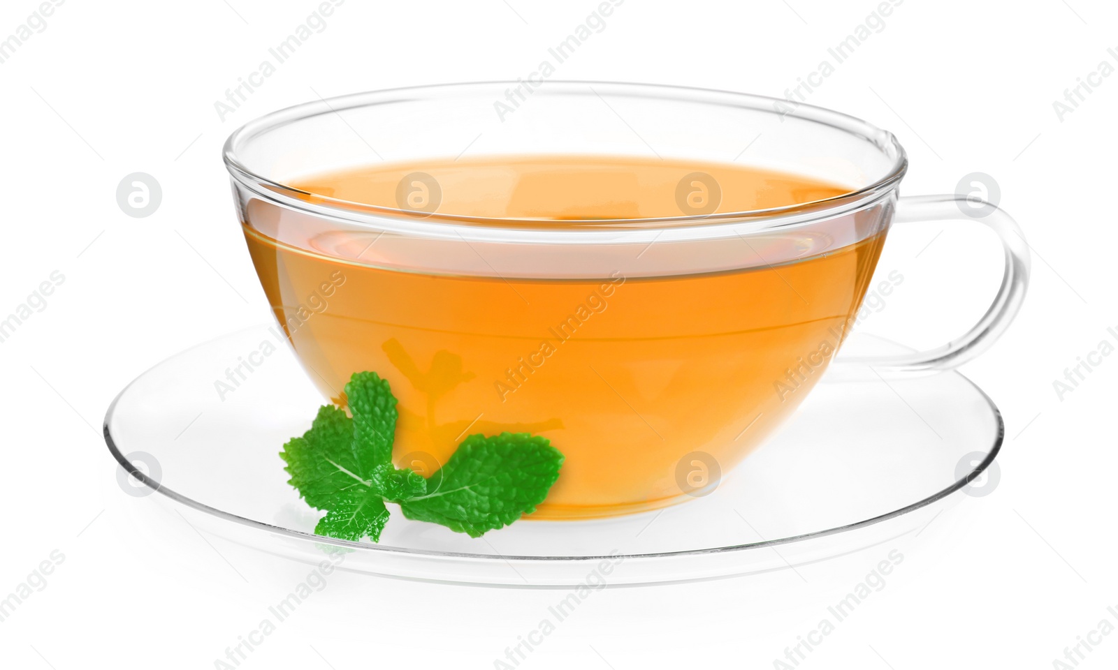 Photo of Fresh green tea in glass cup, mint and saucer isolated on white