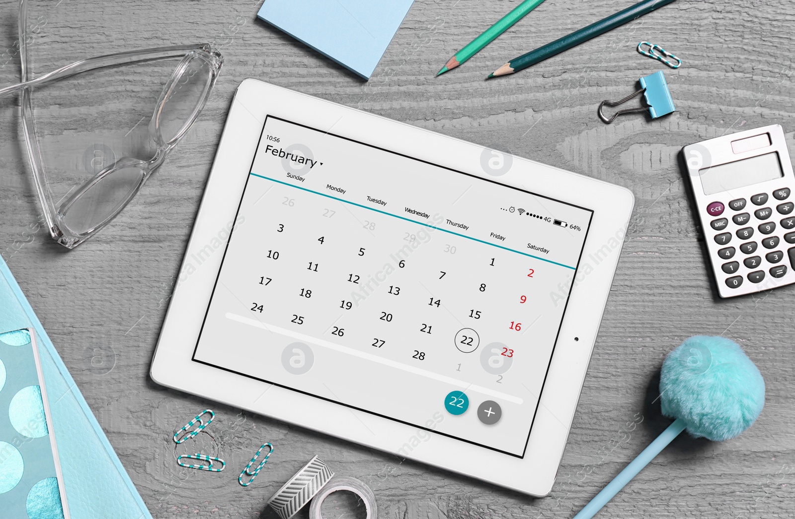 Photo of Flat lay composition of tablet with calendar app on grey wooden table