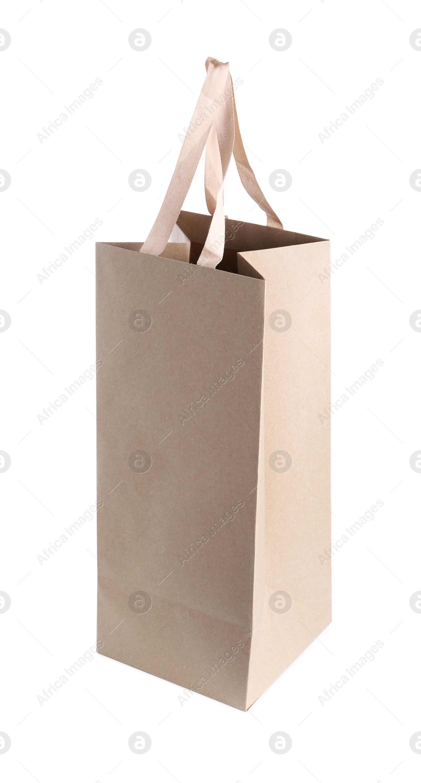 Photo of One paper bag isolated on white. Mockup for design