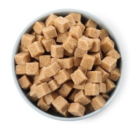 Bowl and brown sugar cubes on white background, top view