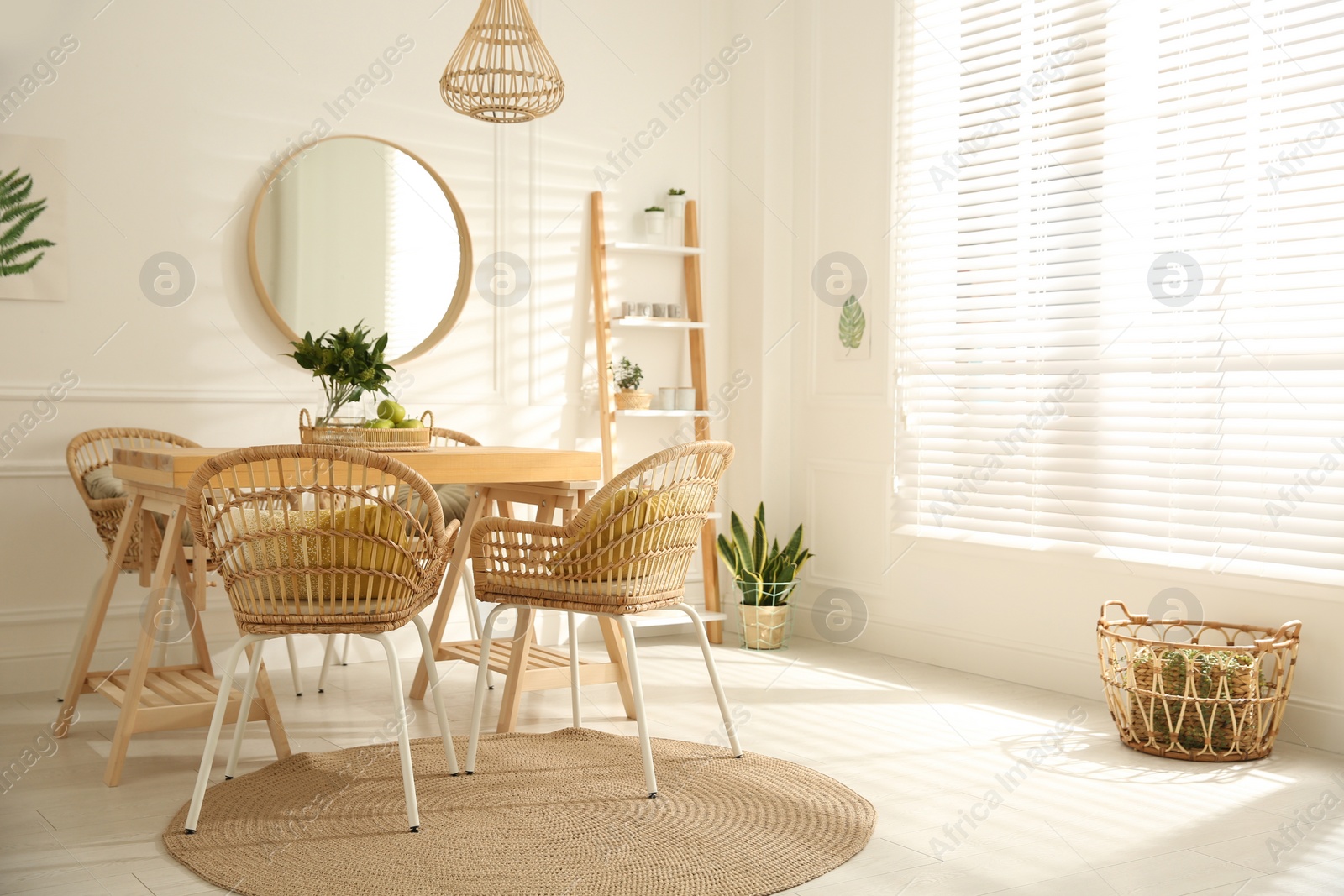 Photo of Stylish wooden dining table and chairs in room. Interior design