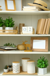 White shelving unit with different decorative elements