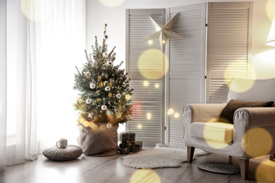 Stylish room interior with elegant Christmas decor