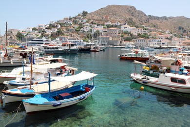 Photo of Beautiful view of coastal city with different boats on sunny day