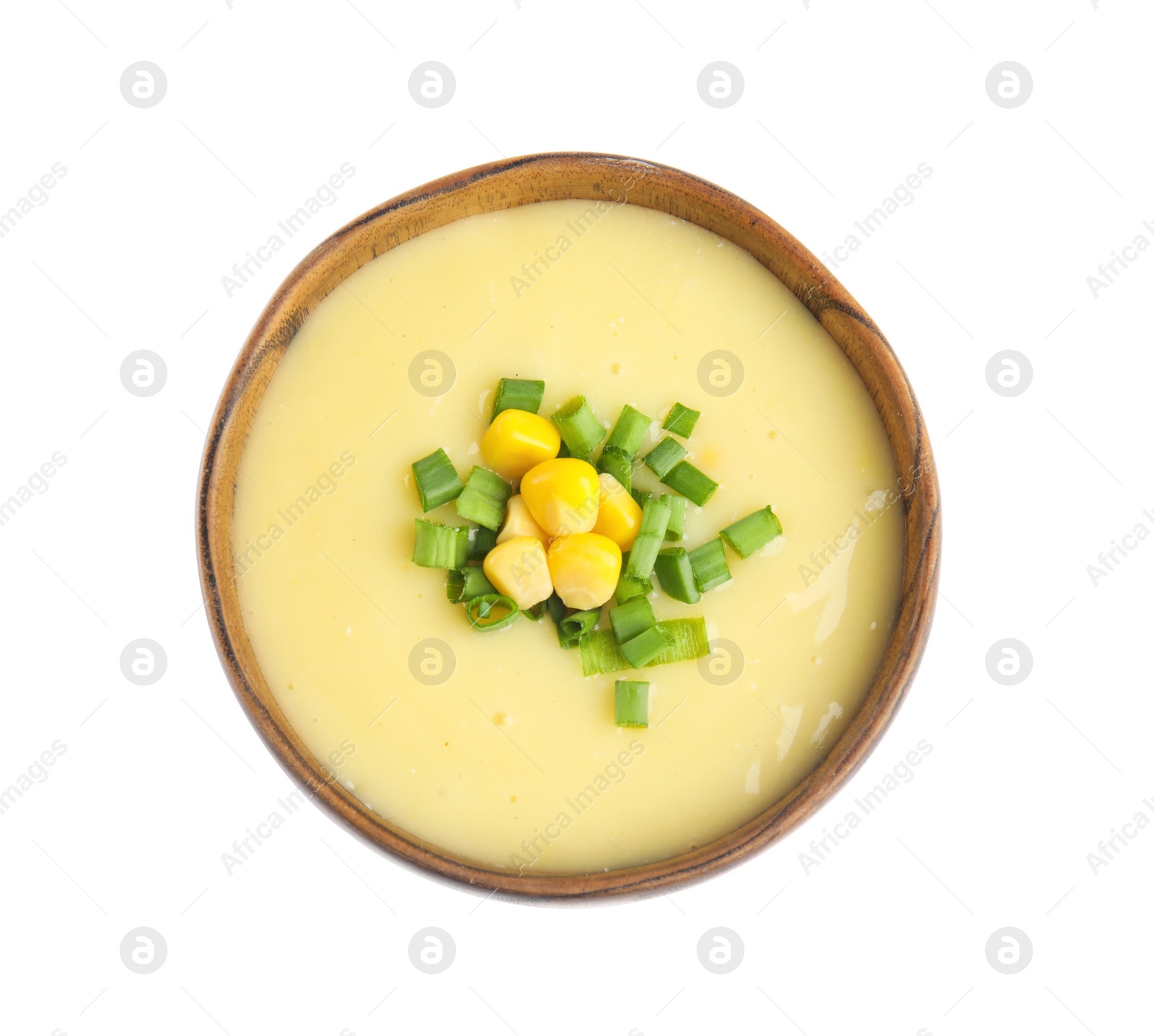 Photo of Delicious corn cream soup isolated on white, top view