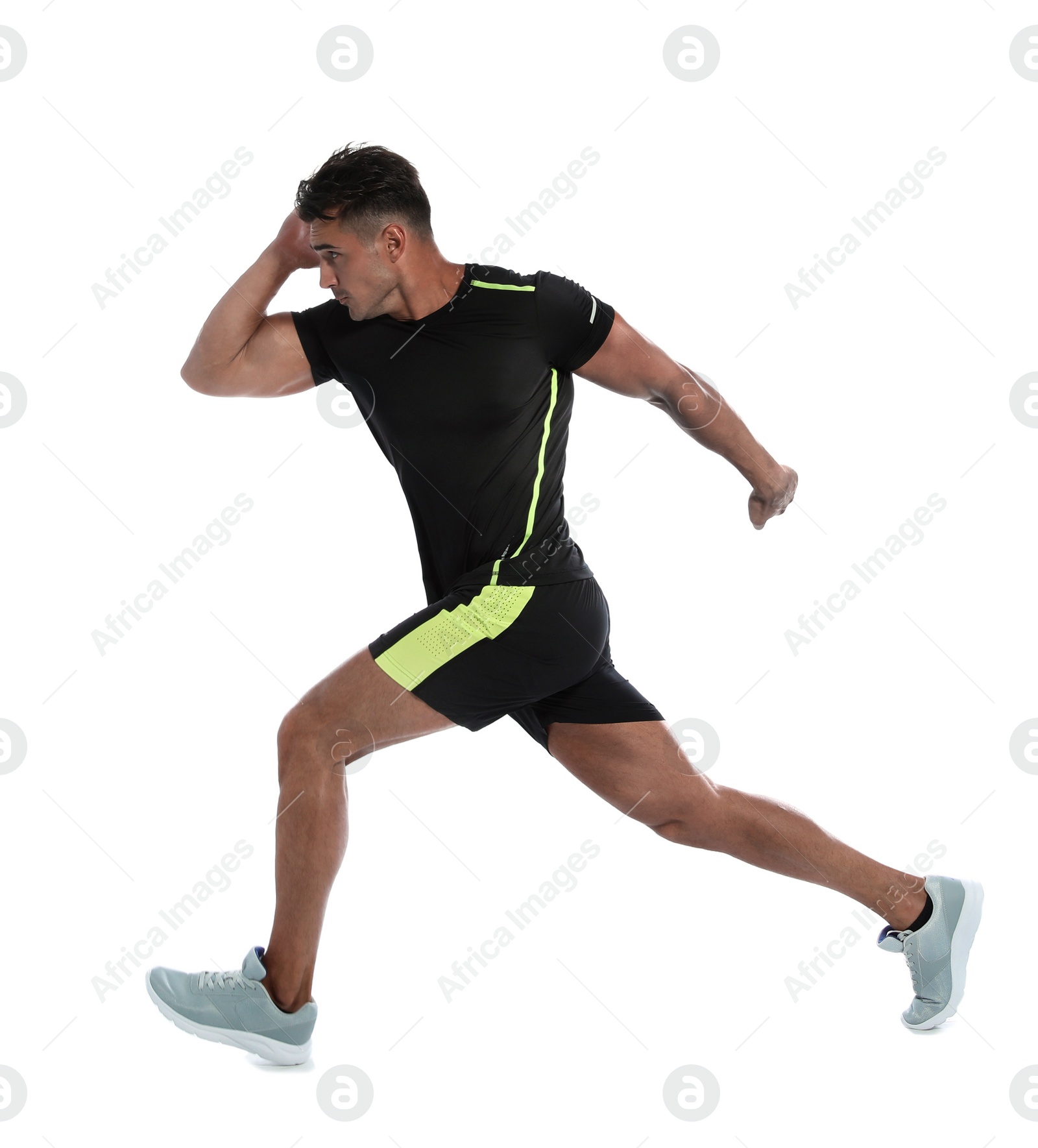 Photo of Sporty young man running on white background