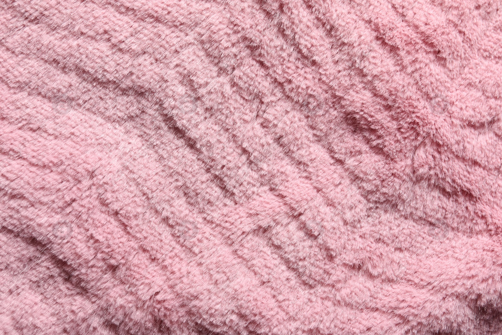 Photo of Texture of pink faux fur as background, top view