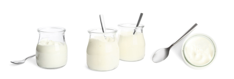 Image of Set of delicious natural yogurt in glass jars with spoons on white background. Banner design