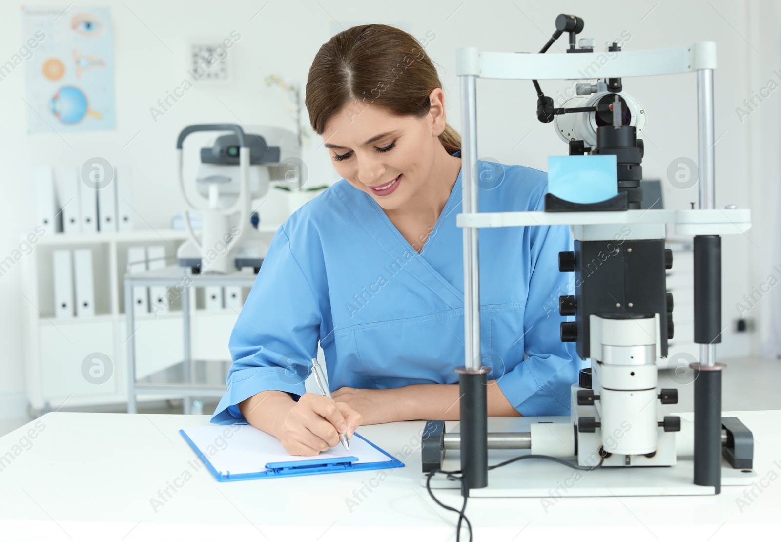Photo of Ophthalmologist with modern equipment in clinic